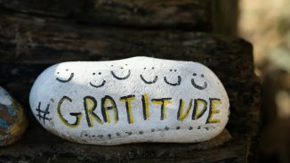 a white and yellow object with writing on it